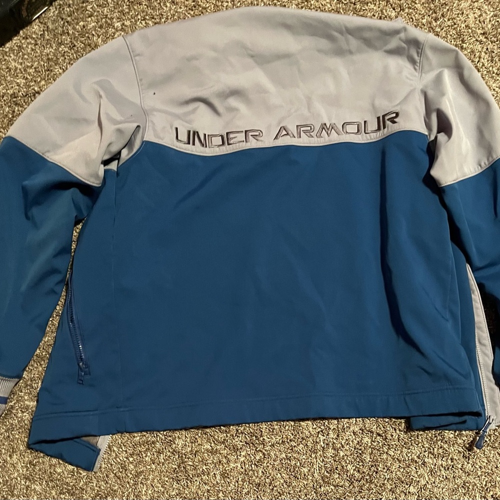 Blue and grey under armor zip up.